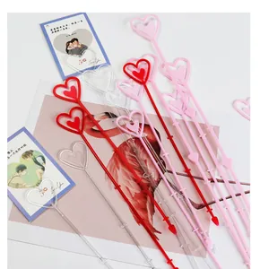 Detailed view of assorted heart-shaped plastic floral card holder sticks for bouquets