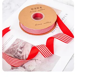 Detail view of red and white vertical striped grosgrain ribbon for floral gift wrapping