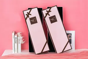 Detailed view of pink rectangular flower box with brown ribbon bow and Love Rose text
