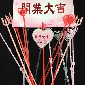 Close-up of heart-shaped plastic bouquet card holders with festive themed decorative greeting cards