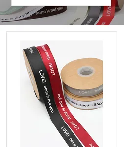 Close-up of grosgrain ribbons with 'LOVE! none is not you' text for flower wrapping.