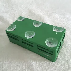 Bottom view of green floral foam tray with six clear suction cups for wedding car.