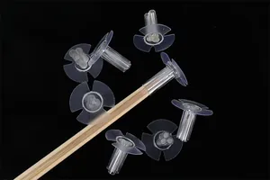 Detailed view of clear flower arrangement holders for DIY snack bouquets and bamboo sticks