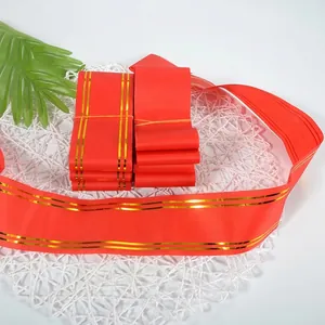 Vibrant red decorative ribbon with elegant gold stripes for opening ceremony flower baskets