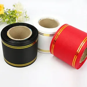Premium gold-edged satin ribbon rolls in black white and red for floral decor supplies