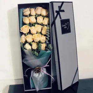 Elegant rectangular gift box with champagne roses and eucalyptus for Valentine's Day.