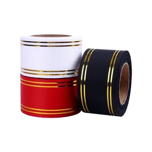 Decorative gold-edged satin ribbons in red, white, and black for floral gift wrapping.