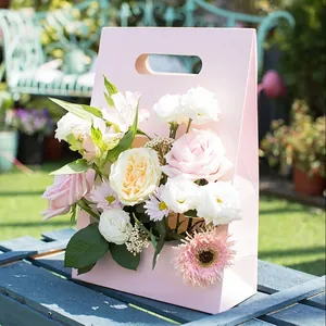 Elegant pink foldable paper flower basket gift box with handle for floral gift arrangements