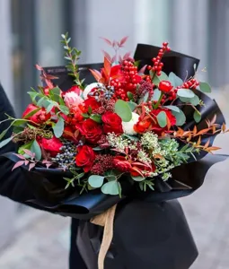 Close-up of premium matte black waterproof floral wrapping paper on a rose bouquet