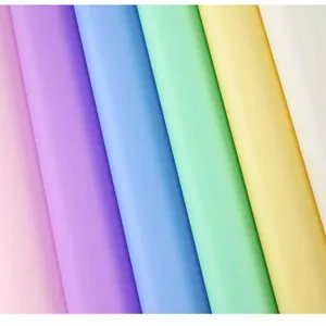 Macro detail of waterproof matte floral wrapping paper in vibrant multiple pastel colors