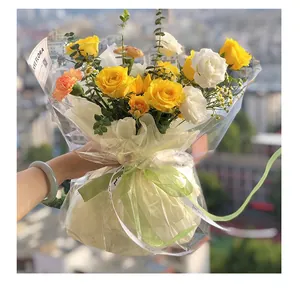 Detail of transparent thickened cellophane used for wrapping a yellow rose bouquet