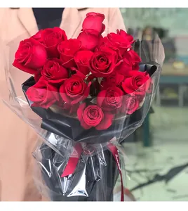 Macro view of transparent waterproof flower wrapping cellophane around red roses