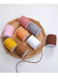 Assorted colorful faux suede velvet cords on spools for DIY jewelry making and crafts