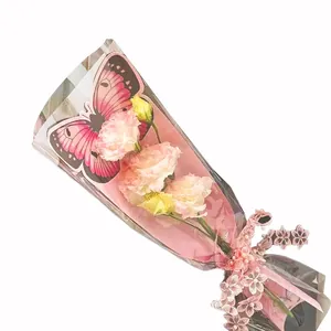 Schmetterling Blumenverpackung für Einzelblüten mit rosa Spitzenband und Einsatz