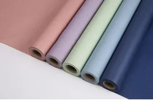 Detailed close-up view of multiple colorful waterproof art paper rolls for elegant floral gift wrapping