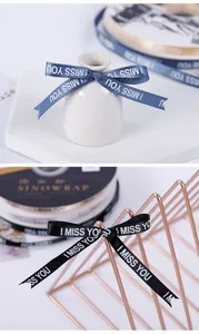 Dettaglio di nastro da 1 cm con stampa I MISS YOU per confezioni regalo