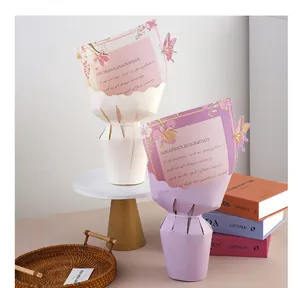 Two elegant decorative floral bouquet cones in pink and purple with 3D butterfly accents.
