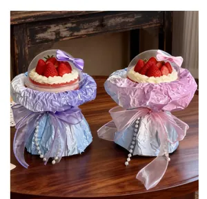 Detail of cake bouquet DIY packaging materials with clear dome lids and ribbons