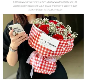 Red and white checkered flower wrapping paper shown on a fresh rose bouquet for gifts