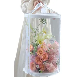 Large transparent PVC round flower box with ribbon handle for floral arrangements