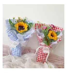 Sunflower bouquets wrapped in red and blue gingham checkered flower wrapping paper texture