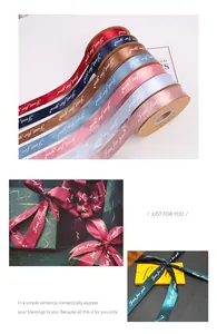 A detail view of various colors of Just For You satin ribbons on elegant gift boxes