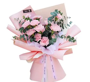 Pink carnation bouquet wrapped in waterproof double-sided peach florist paper detail
