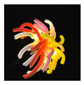 Detail view of glowing colorful DIY pipe cleaner fireworks with warm LED lights