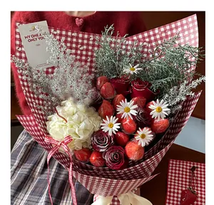 Detailed view of a floral bouquet wrapped in retro red and white checkered gift paper