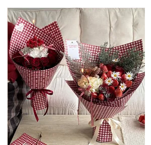 Red and white checkered gift wrapping paper used for elegant Christmas flower bouquets