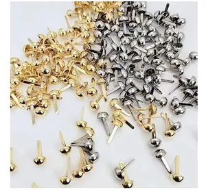 Macro view of gold and silver round head metal brads for crafts and card making