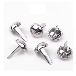 Close-up detail of silver round head metal split pins for paper fastening and crafts