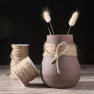 Natural brown jute twine rolls for vintage flower gift packaging and DIY crafts.