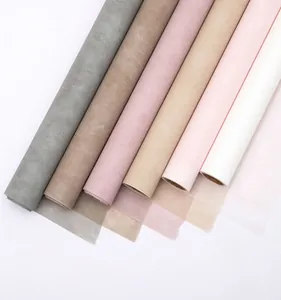 Close-up of waterproof milk cotton non-woven flower wrapping paper rolls in various colors.