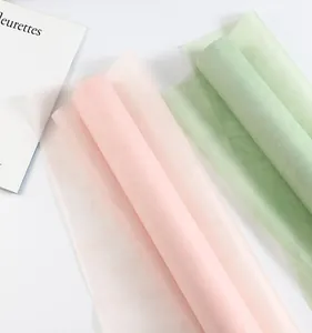 Close-up of pink and green milk cotton non-woven rolls for flower wrapping