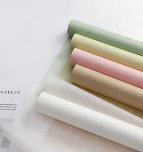 Detailed view of various pastel color milk cotton non-woven flower wrapping paper rolls