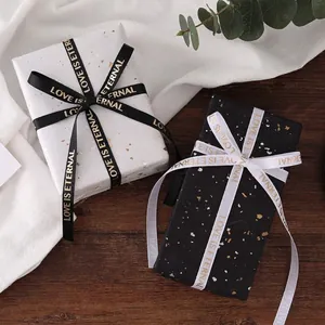1cm gold foil grosgrain ribbon with LOVE IS ETERNAL text for elegant gift wrapping