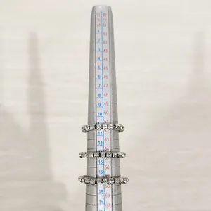 Close-up of stainless steel textured bead elastic rings on a size measuring tool