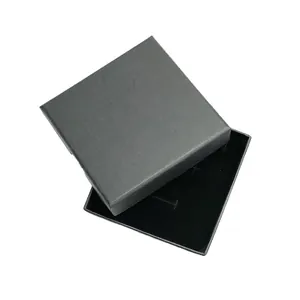 Detailed view of an open black jewelry box with soft velvet lining for necklaces.