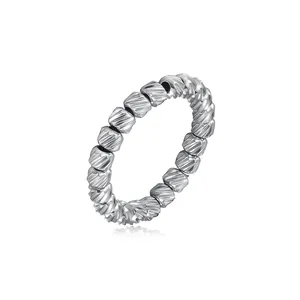 Macro view showing the detailed diagonal texture on silver stainless steel beads ring