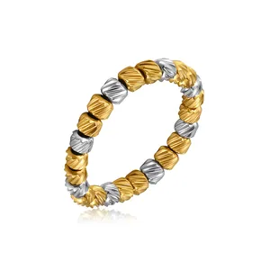 Detail view of two-tone gold and silver stainless steel ring with slanted textured beads.