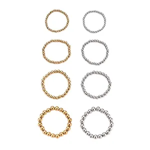 Primer plano de anillos elásticos de cuentas de acero de titanio dorado y plateado.