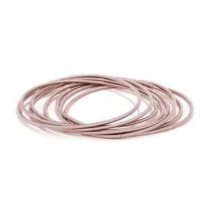 Detailed view of stacked 1.7mm 304 stainless steel spring bracelets in rose gold finish