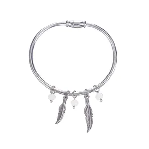 Vintage 304 stainless steel spring bangle with feather charms and white bead accents