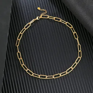 Detailed macro view of golden stainless steel paperclip link chain necklace texture