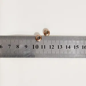 Close-up of rose gold stainless steel bead ends for DIY bracelet size measurement