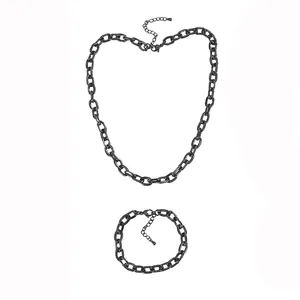Detailed top-down view of black stainless steel beveled link chain necklace and bracelet set