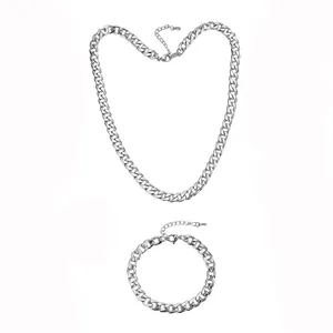 Detailed view of silver stainless steel chunky Cuban chain necklace and bracelet set