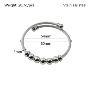 Detailed macro view showing dimensions of a stainless steel beaded wire bracelet