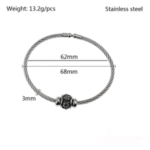 Detailed view of stainless steel wire cable bangle with skull bead and dimensions.